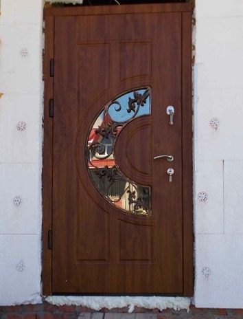 Дверь с ковкой и стеклом